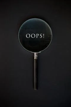 "Oops" word on a black background Stock Photos