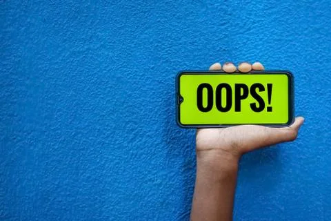 OOPS wording on smart phone screen isolated on blue background with copy spac Stock Photos