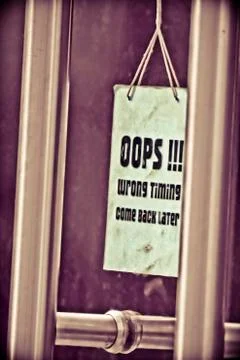 Oops wrong timing come back later, notice at hotel door Stock Photos