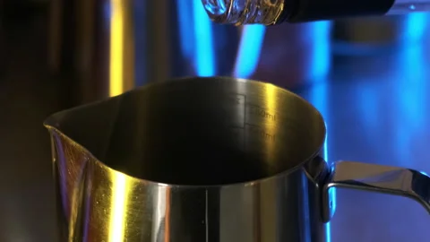 Oouring syrup into a pitcher. Slow motion. Stock Footage 183969403