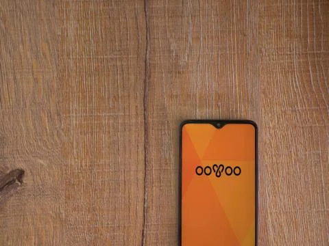 OoVoo app launch screen with logo on the display of a black mobile smartphone Stock Photos