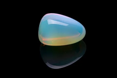 Opalite gemstone isolated on black background. Macro shot. Stock Photos