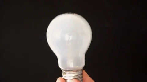Opaque Light Bulb Shattering and Exploding Slow Motion Stock-Footage 77083126