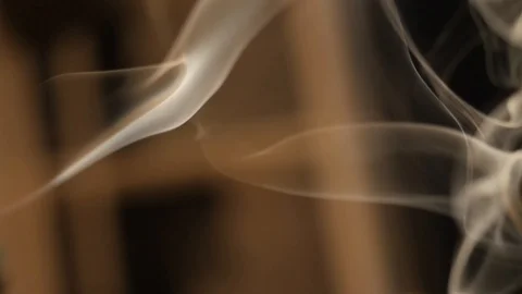 Opaque smoke blown into the air golden light movement dreaming slow motion Stock Footage