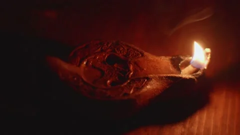 Opaque with tallow that burns on the table producing a flame with little lig Stock-Footage 148258335