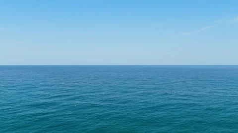 The open Aegean Sea under a clear blue sky, filmed from Chorefto Beach in the Stock Footage 346697043