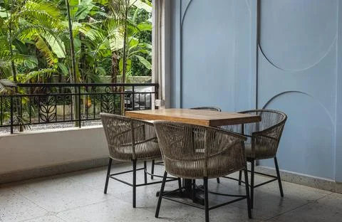 Open-air dining space with rustic table setting. Outdoor dining space with wi Stock Photos