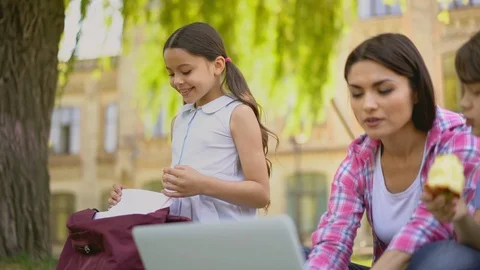 Open air lesson with teacher using laptop. Stock Footage 130054102