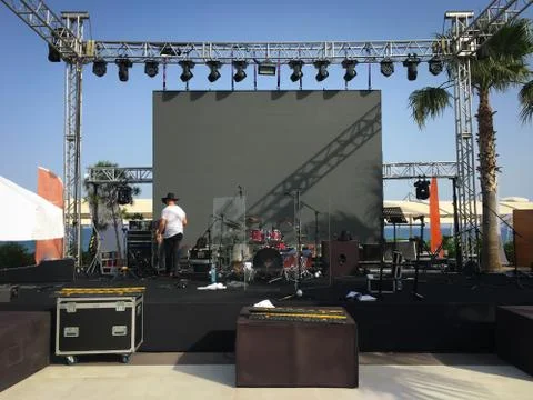Open air show stage set up with led screen, sound and light system. Back line Stock Photos
