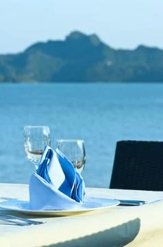 Open-air table setting for meals with elegant dishware Stock Photos