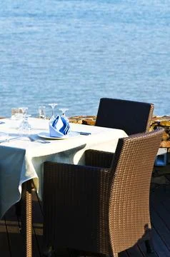 Open-air table setting for meals with elegant dishware Stock Photos