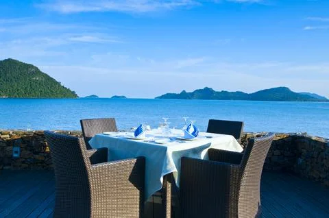 Open-air table setting for meals with elegant dishware Stock Photos