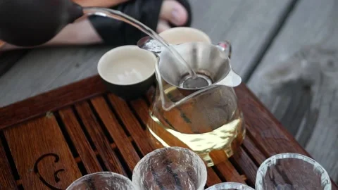 Open-air tea ceremony tea according to a traditional recipe Stock Footage 157872282