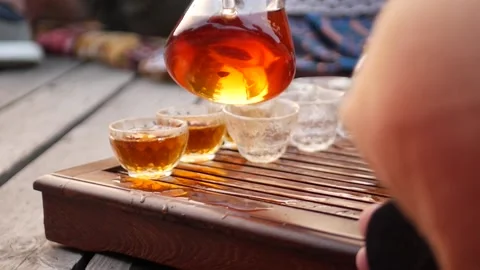 Open-air tea ceremony tea according to a traditional recipe Stock Footage 157872336