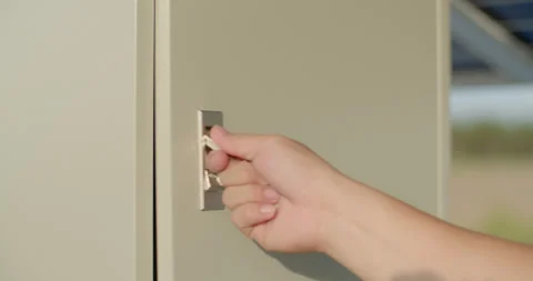 Open and close the control cabinet.Press and pull to open the cabinet. Stock Footage 306247445