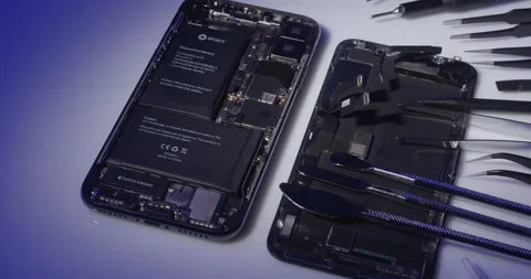 Open Apple iPhone 10 with repair tools for replacing Smartphone Battery. Stock Footage 237396396