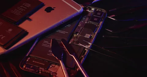 Open Apple iPhone revealing battery and internals of Smartphone Stock Footage 237410806