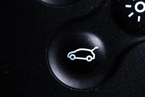 The open baggage icon button is close on the digital car key device. Old an.. Stock Photos