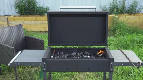 Open barbecue with burning coals.  Brazier in the backyard of a country house. Stock Footage 137208565