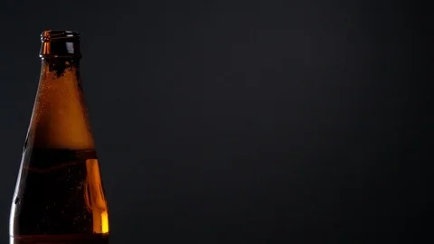Open beer bottle with foam Stock Footage 125373661