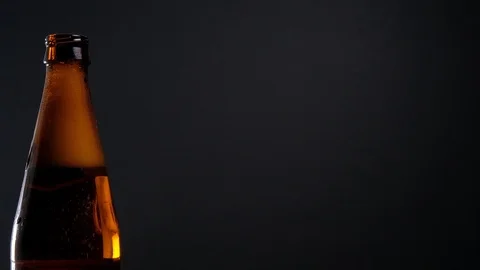 Open beer bottle with foam Stock Footage 125382266