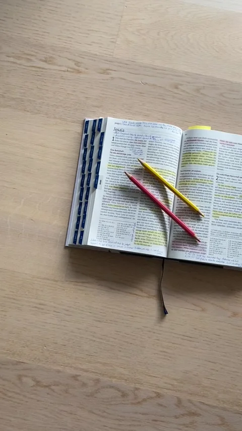 Open Bible. Bible Study with pencils and highlighters Stock Footage 199673360