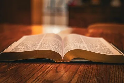 Open Bible Book on table Edited Stock Photos