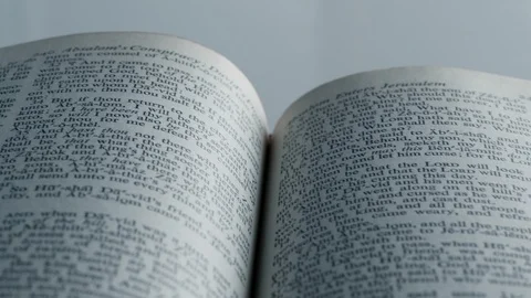 Open Bible with diagonal pull back dolly movement Stock Footage 124761709
