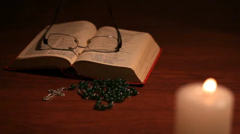 An open bible with an open glasses Video stock 58316213