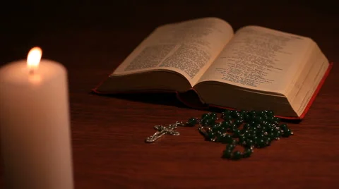 An open bible with a rosary Stock Footage 58313029