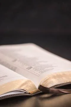 Open Bible on a Slate Tabletop with Customizable Space to Add Text Stock Photos