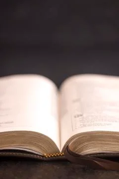 Open Bible on a Slate Tabletop with Customizable Space to Add Text Stock Photos