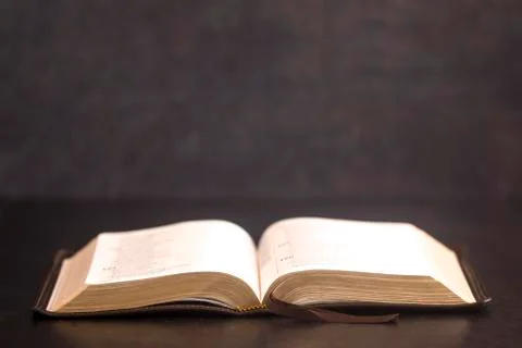 Open Bible on a Slate Tabletop with Customizable Space to Add Text Foto stock