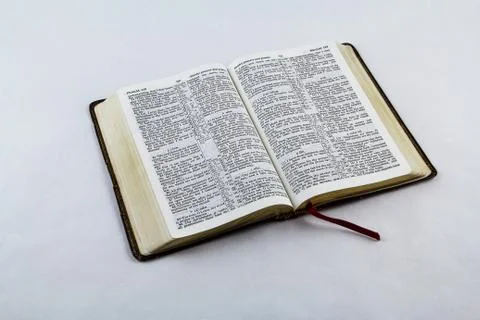 Open Bible on White Background Stock Photos