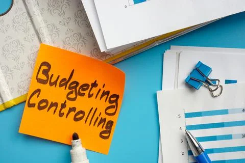 Open big folder and budgeting controlling sign. Stock Photos