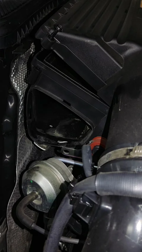 An open black plastic car air filter housing inside engine bay. Stock Footage 343415012