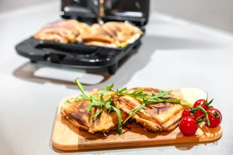 Open black sandwich maker Stock Photos