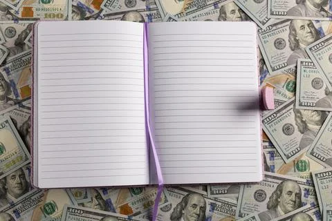 Open Blank Lined Notebook with Bookmark on a Background of US Hundred Dolla.. Stock Photos