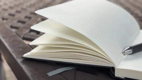 Open blank notebook, handheld Stock Footage 323878759