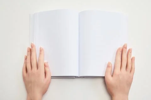 Open Blank Notebook. Hands holding an open blank notebook Stock Photos