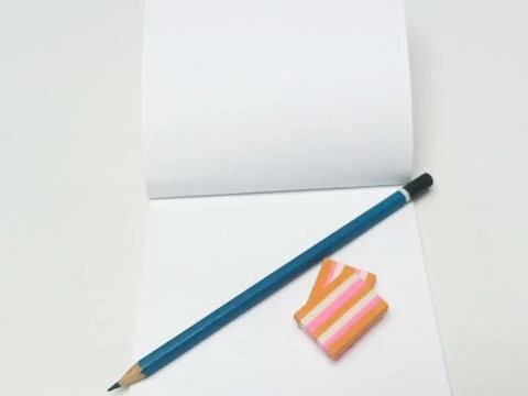 Open blank notebook with pencil and eraser back to school concept Stock Photos
