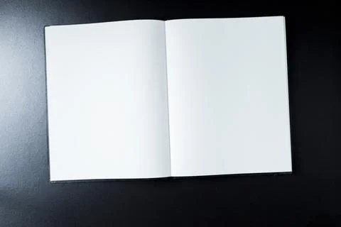 Open blank notebook with stationery accessories. Top view. Post it notes. smi Stock Photos