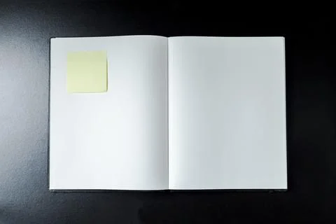 Open blank notebook with stationery accessories. Top view. Post it notes. smi 库存照片