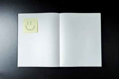 Open blank notebook with stationery accessories. Top view. Post it notes. smi Stock Photos