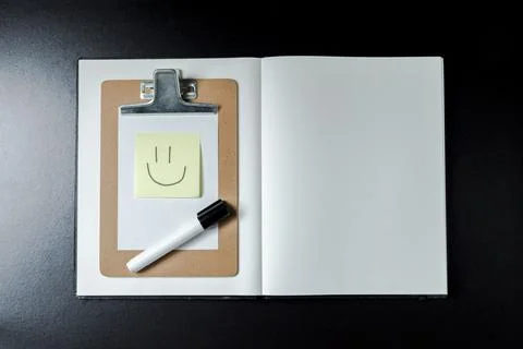 Open blank notebook with stationery accessories. Top view. Post it notes. smi Stock Photos