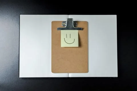 Open blank notebook with stationery accessories. Top view. Post it notes. smi Stock Photos