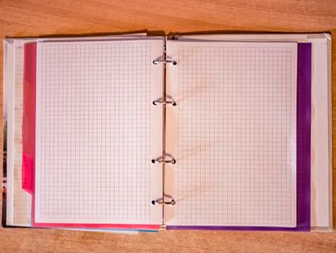 Open blank notebook on the table top view. Stock Photos