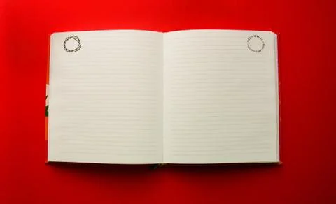 Open blank notepad on red background with copy space Stock Photos