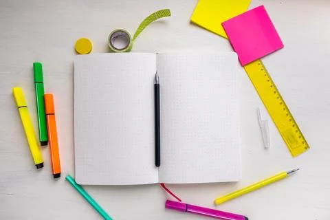 Open blank of planner with dotted pages with a pen, markers, ruler, stickers Stock Photos