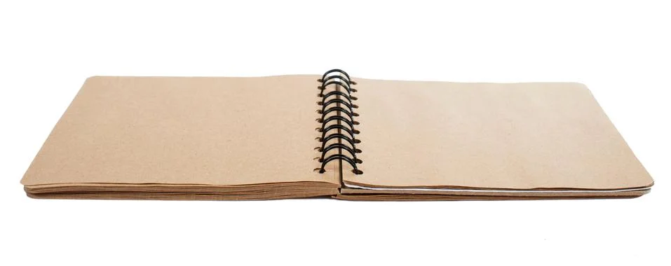 Open blank square notebook from brown craft paper with a spiral lies on a whi Stock Photos